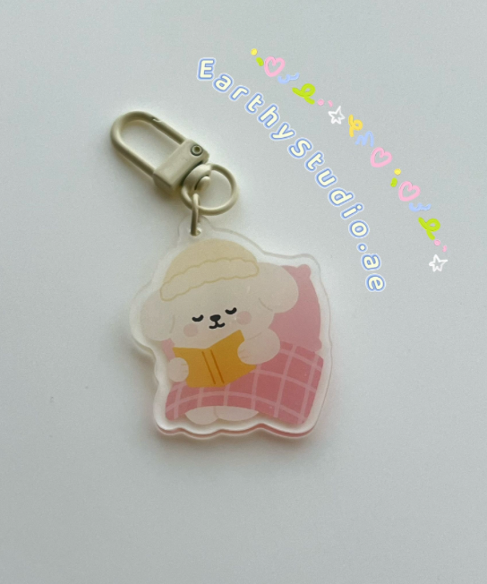 Poppy reading book keychain